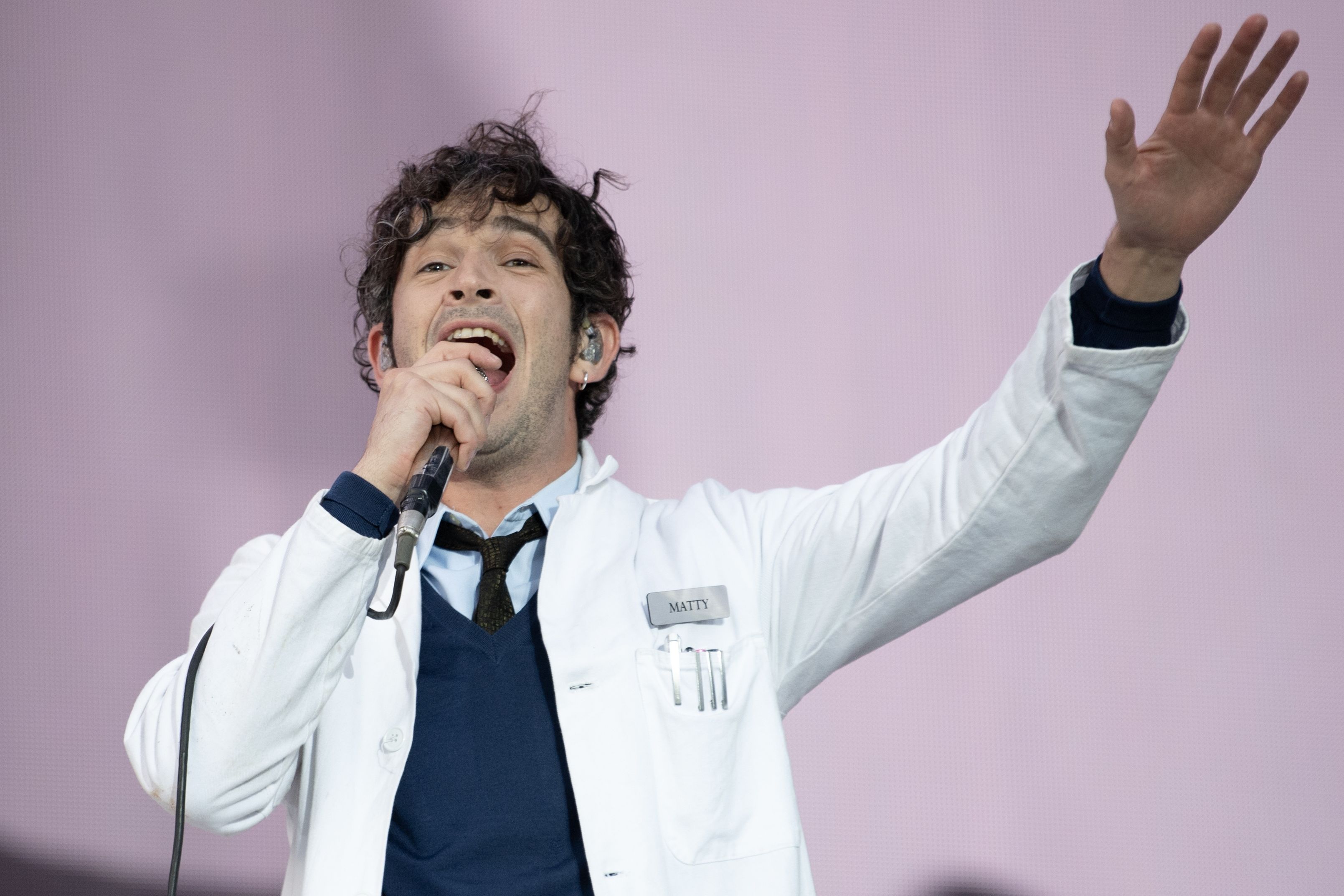 Lawsuit Filed by Festival Cancelled Due to The 1975’s Matty Healy’s On-Stage Kiss with Bandmate