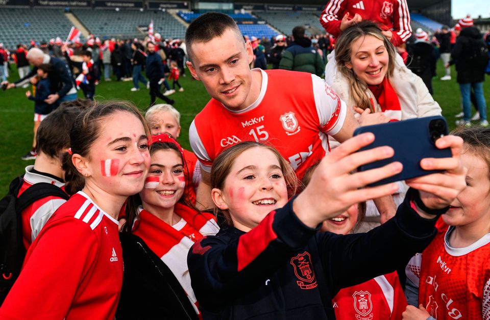 Con O’Callaghan poses for a photo with supporters after the final whistle in Parnell Park. Pic: Daire Brennan/Sportsfile