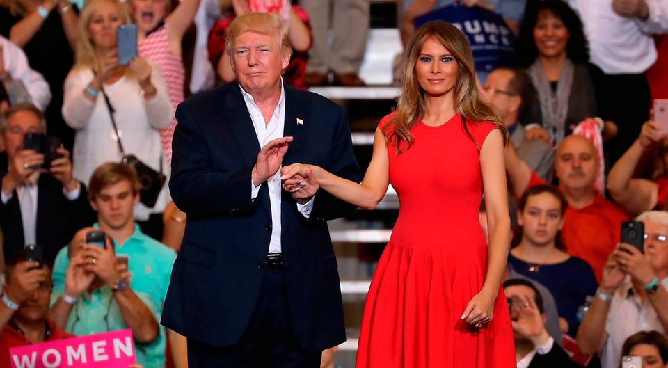 President Donald Trump and Melania Trump stand together during a campaign rally at the AeroMod International hangar at Orlando Melbourne International Airport on February 18, 2017 in Melbourne, Florida. President Trump is holding his rally as he continues to try to push his agenda through in Washington, DC.  (Photo by Joe Raedle/Getty Images)