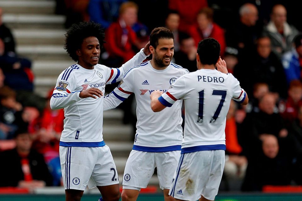 Chelsea's Willian celebrates scoring his side's third goal of the game with team-mates Chelsea's Cesc Fabregas and Chelsea's Pedro during the Barclays Premier League match at the Vitality Stadium, Bournemouth.