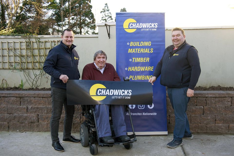 Jerry Lynch and Denis O’Regan of Chadwicks with Terry O’Brien in the new-look garden at the Irish Wheelchair Association’s Listowel base.