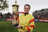 thumbnail: Trainer and rider Barry Walsh with the La Touche Cup after his win on Singing Banjo. Photo: Dave Barrett