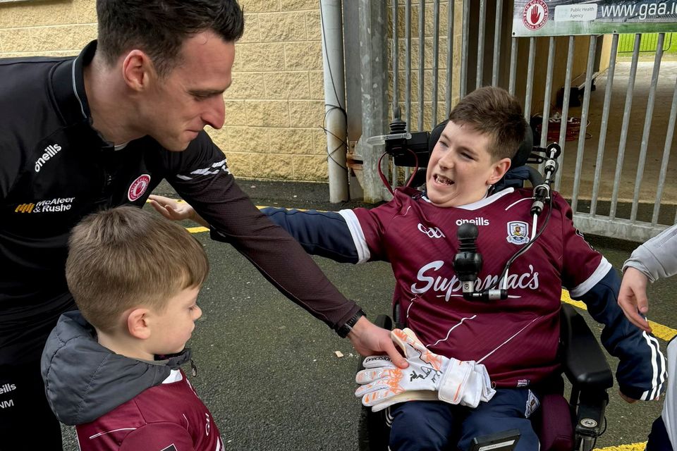Tyrone GAA's Niall Morgan extends the hand of friendship to Galway fan Tomás McLoughlin with signed goalie gloves (Credit: @for_tomas on Twitter/X)