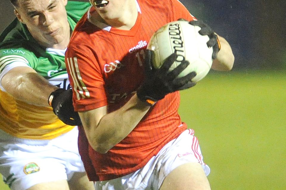 Kieran McArdle, Louth, is challenged by Diarmuid Finneran, Offaly, during the U20 LFC game in Stabannon. Photo: Aidan Dullaghan/Newspics