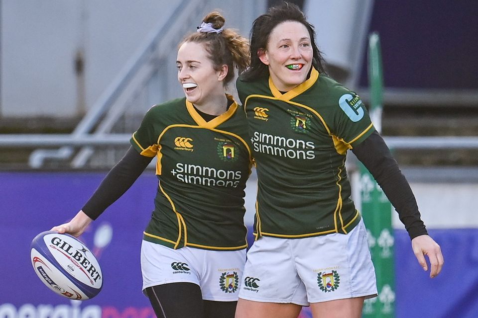 Railway Union's Molly Scuffil McCabe, left, celebrates with team-mate Lindsay Peat after scoring a try during the Energia AIL final against Blackrock College at Energia Park in December 2022. Photo: Seb Daly/Sportsfile