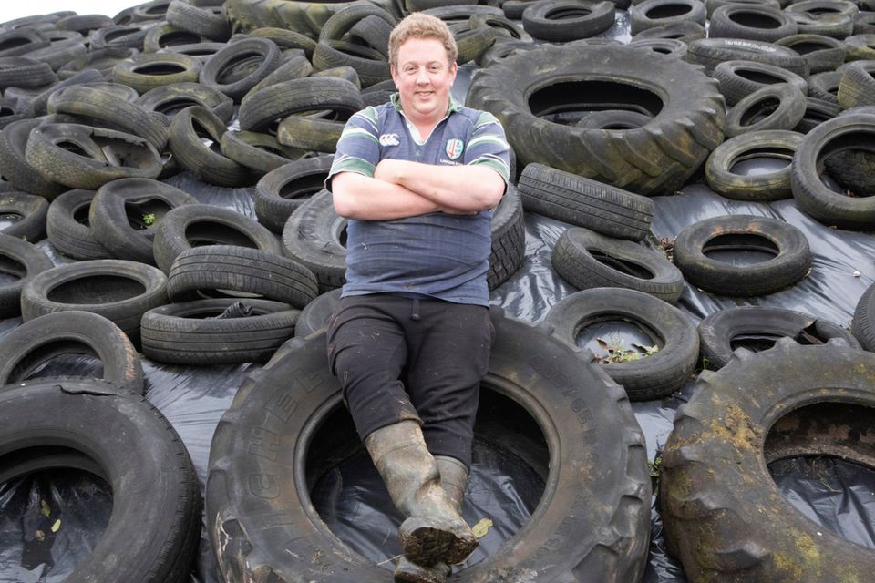 Tyre-ing work: Bill Gleeson on his farm in Tipperary; inset: on his tractor. Photo:  Liam Burke/Press 22