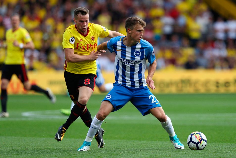 Watford's Tom Cleverley in action with Brighton's Solly March Photo: REUTERS/Eddie Keogh