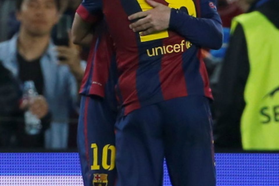 Barcelona's Lionel Messi, right, celebrates after scoring the opening goal during the Champions League semifinal first leg soccer match between Barcelona and Bayern Munich at the Camp Nou stadium in Barcelona, Spain, Wednesday, May 6, 2015.  (AP Photo/Emilio Morenatti)