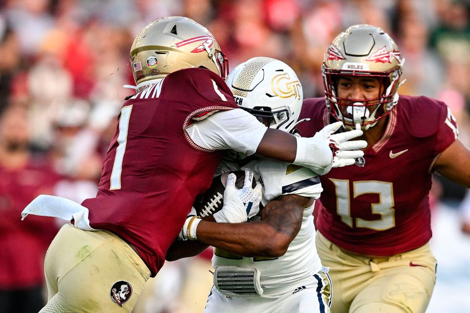 24 August 2024; Georgia Tech Yellow Jackets running back Chad Alexander is tackled by Florida State Seminoles defensive back Shyheim Brown during the 2024 Aer Lingus College Football Classic match between Florida State and Georgia Tech at Aviva Stadium in Dublin. Photo by Brendan Moran/Sportsfile 