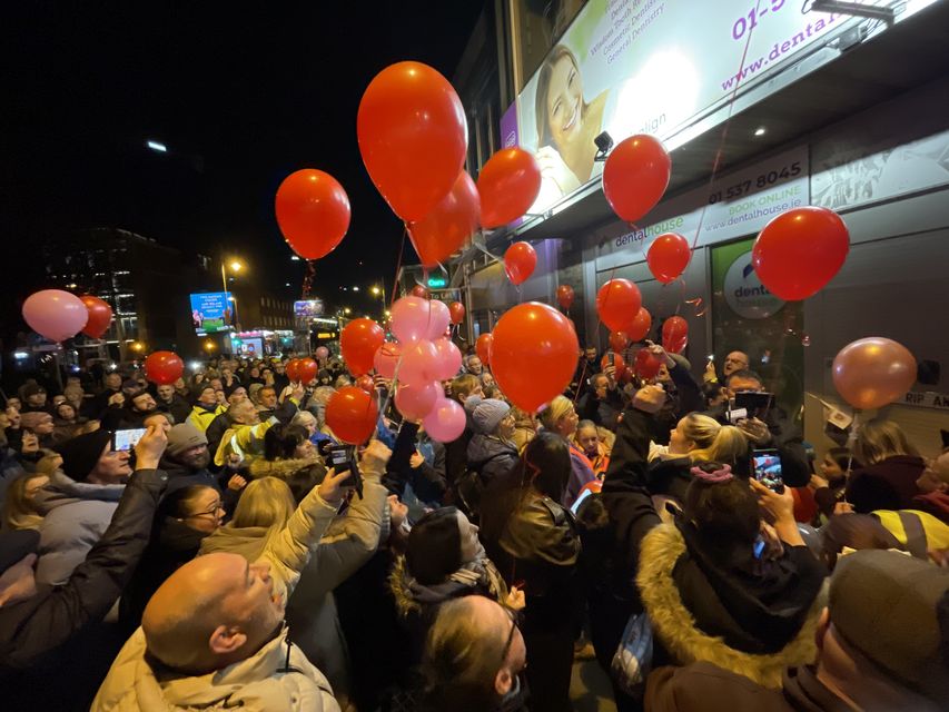 People release balloons at the spot on Aungier Street, Dublin, where Ann Delaney usually sat. Photo: RollingNews.ie