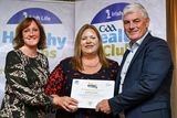 thumbnail: Brenda Donohoe and Sharon Sheerin from Bray Emmets GAA Clubreceiving their gold award from Leinster Council Health and Wellbeing Chairperson Dave Murray. 