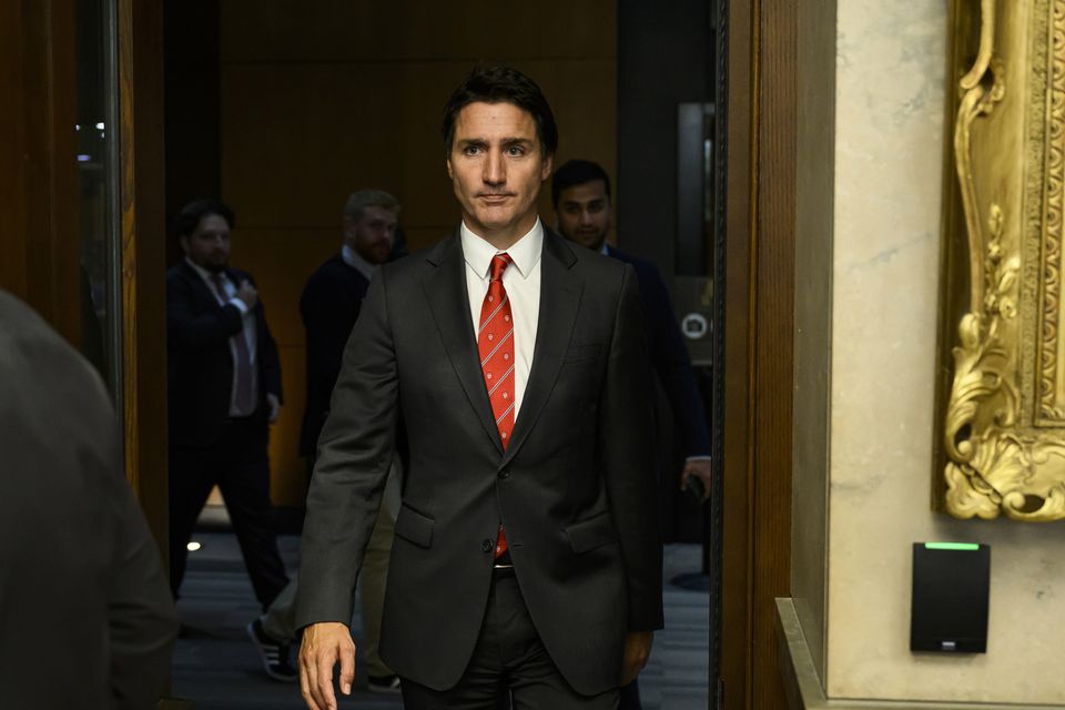 Canada Prime Minister Justin Trudeau leaves the House of Commons after making his statement (Justin Tang/The Canadian Press/AP)
