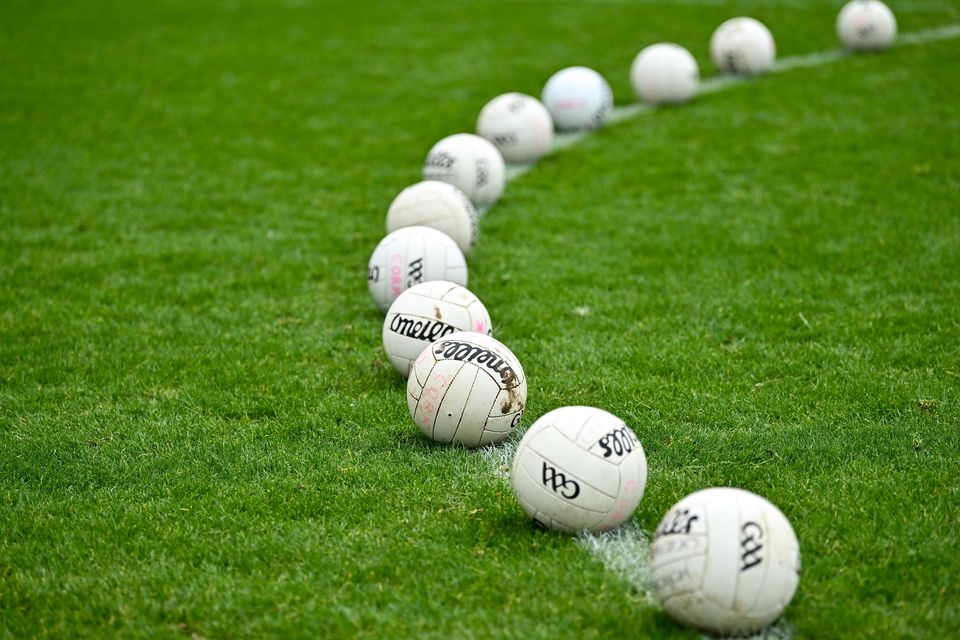 Gaelic footballs on a pitch