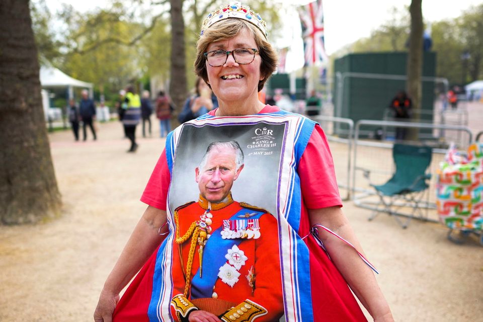 Mandy Ellis shows off her dress made of four tea towels near Buckingham Palace, London, ahead of the the coronation of Britain's King Charles. Photo: Nathan Denette /The Canadian Press via AP