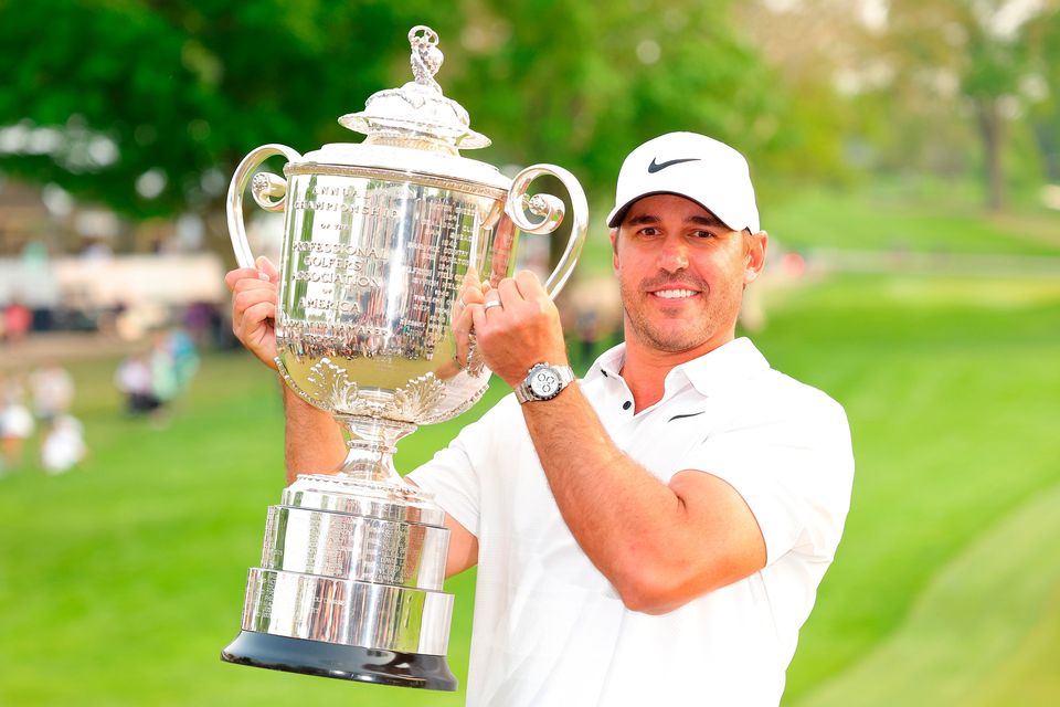 Brooks Koepka celebrates with the Wanamaker Trophy after winning the 2023 PGA Championship. Photo: Getty Images