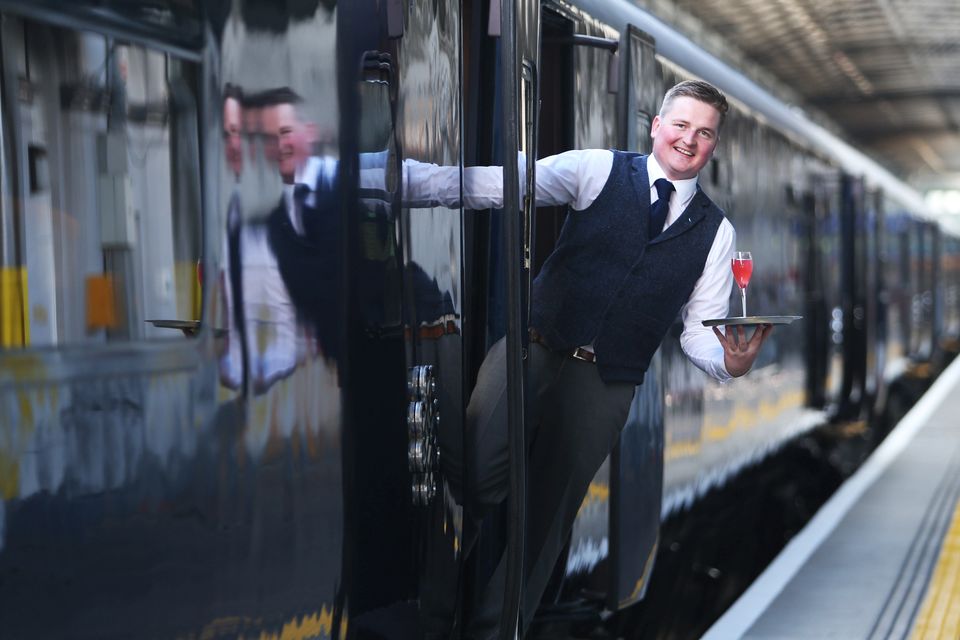 Mark Donegan waits for the first customers to board the Belmond Grand Hibernian at Heuston Station. Photo: Leon Farrell/Photocall Ireland.