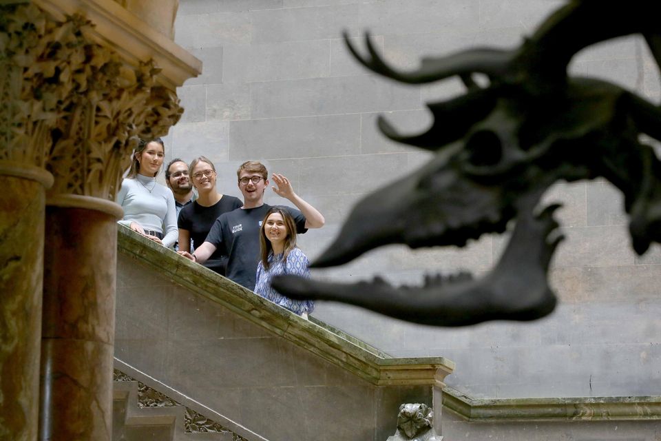Guide Shane Macken (second from the right) and his tour group (from the left) Ceadigh Heslin, Mihir Anand, Shona Hutchinson and Chloe Flanagan inside the Museum Building during one of the new Trinity Trails. Photo: Mark Stedman