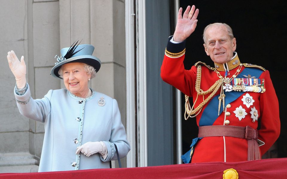 LONDON, ENGLAND - JUNE 11:  HM Queen Elizabeth II and HRH Prince Philip, Duke of Edinburgh wave from the balcony of Buckingham Palace after the Trooping the Colour parade on June 11, 2011 in London, England. The ceremony of Trooping the Colour is believed to have first been performed during the reign of King Charles II. In 1748, it was decided that the parade would be used to mark the official birthday of the Sovereign. More than 600 guardsmen and cavalry make up the parade, a celebration of the Sovereign's official birthday, although the Queen's actual birthday is on 21 April.  (Photo by Dan Kitwood/Getty Images)