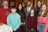 thumbnail: Niamh Tomkins with the V Rev. Joseph Power PP and her family.