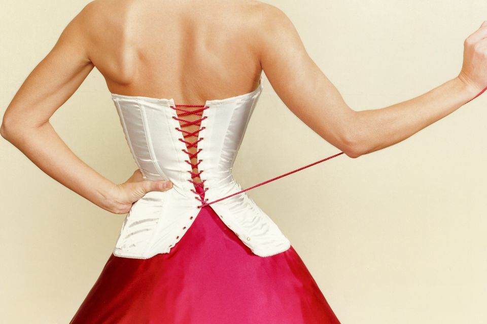 Woman wears a corset 18 HOURS a day because she wants to shrink
