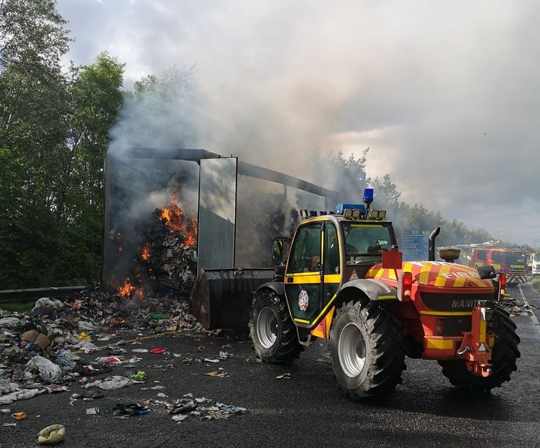 Dublin Fire Brigade's Manitou teleporter has been used to remove the burning waste so it can be extinguished and cooled. Photo: DFB.