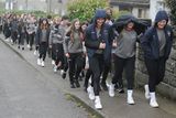 thumbnail: Students sheltering from a shower during the Creagh College 5km Walk in aid of the school's musical and Students Council on Monday. Pic: Jim Campbell
