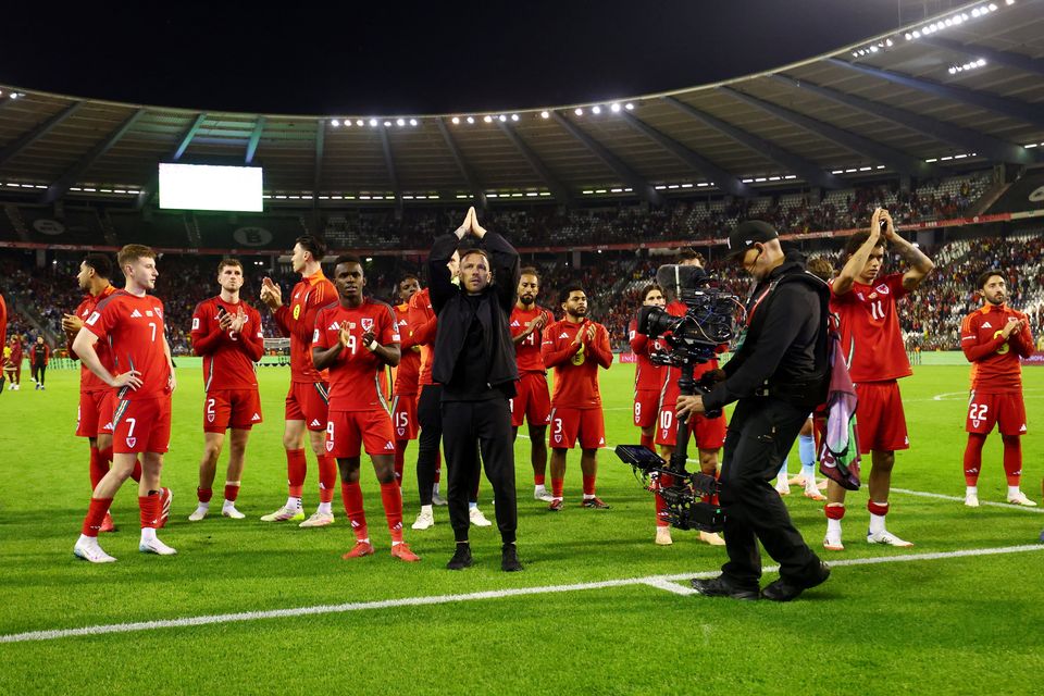 Wales manager Craig Bellamy and players applaud fans after the World Cup Group J qualifier defeat to Belgium at King Baudouin Stadium, Brussels