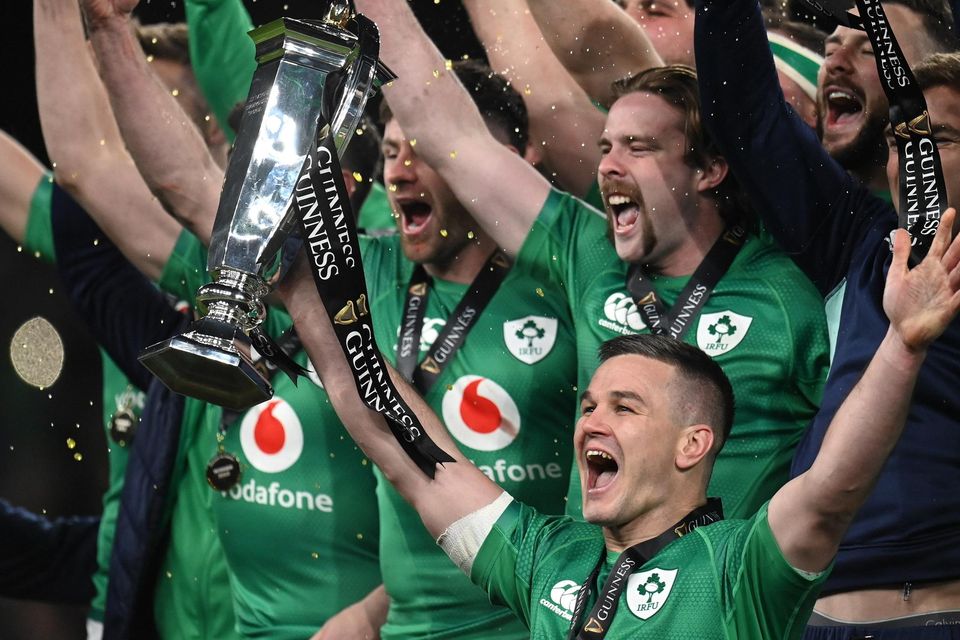 Johnny Sexton and his Ireland team-mates celebrate with the Six Nations trophy after beating England at Aviva Stadium on Saturday to land the Grand Slam. Photo: Harry Murphy/Sportsfile