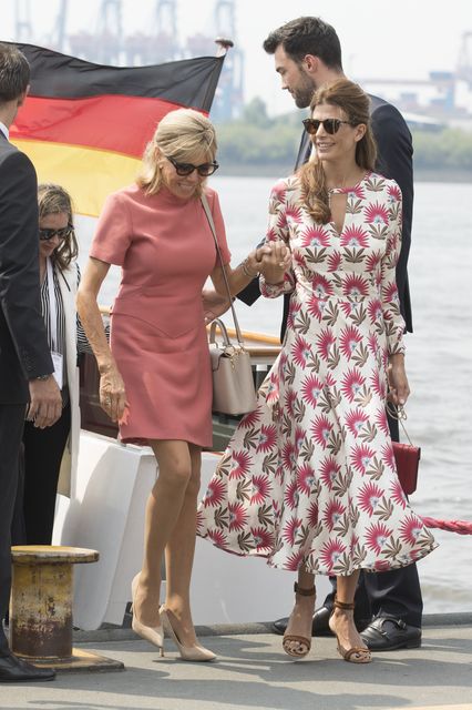 Brigitte Macron, wife of Emmanuel Macron, President of France, and Juliana Awada, wife of Mauricio Macri, Presidentof Argentina, leave the boat "Diplomat" on the river Elbe as they take part in the G20 Summit Spouse Programme on July 7, 2017 in Hamburg, Germany