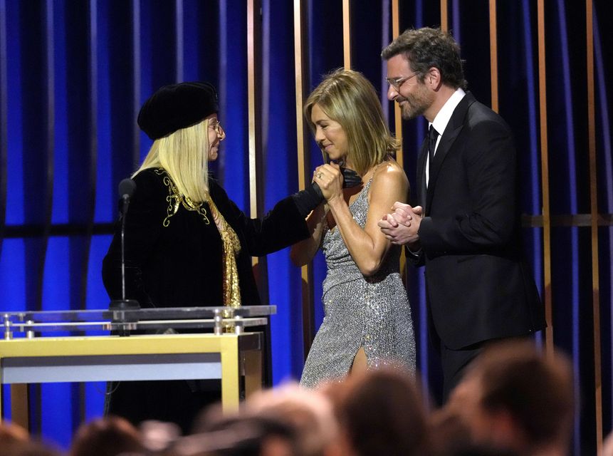 Bradley Cooper, far right, and Jennifer Aniston present the lifetime achievement award to Barbara Streisand, left, during the 30th annual Screen Actors Guild Awards (AP Photo/Chris Pizzello)