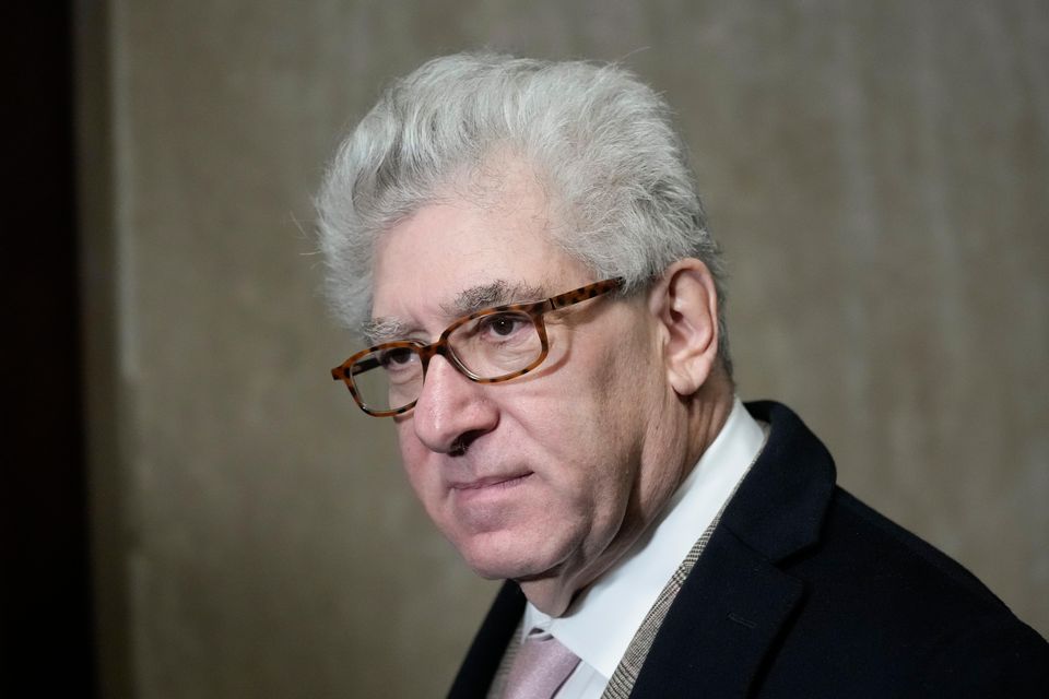 Rare-book dealer Glenn Horowitz hugged family members (Seth Wenig/AP)