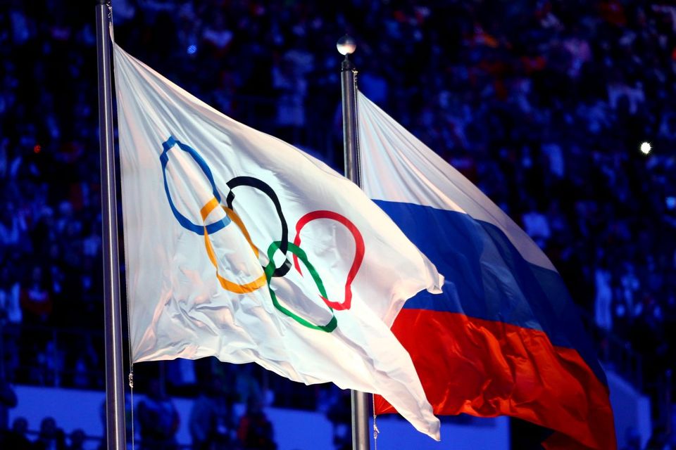 The Olympic flag and Russian flag. Photo: Paul Gilham/Getty Images