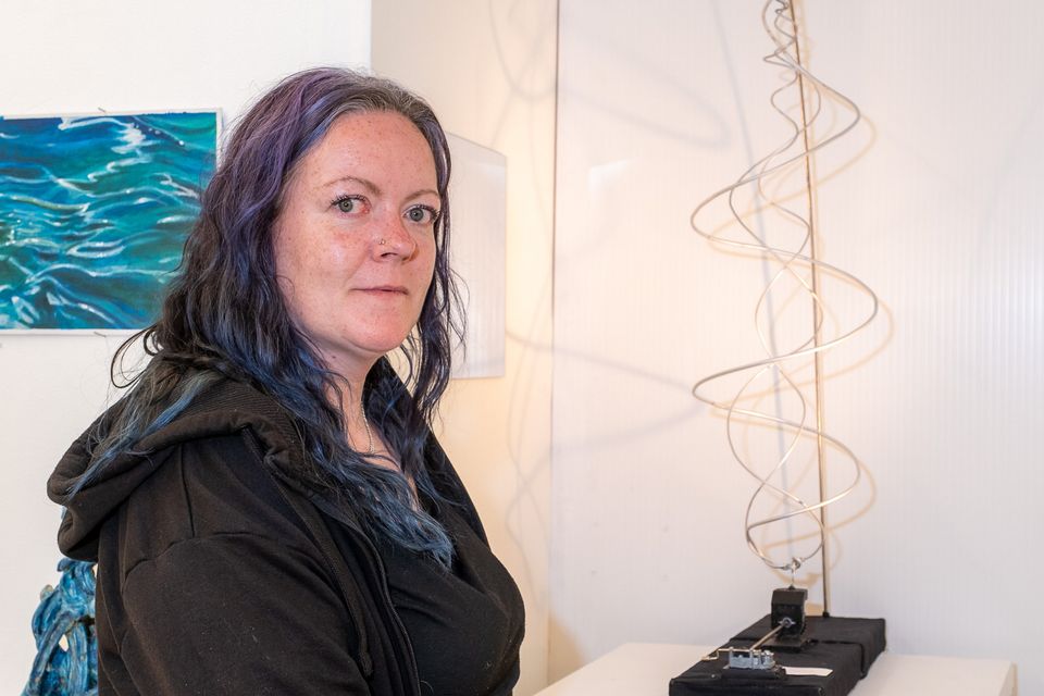 Dee Darcy with her piece 'Attunement', inspired by the Fibonacci sequence. 