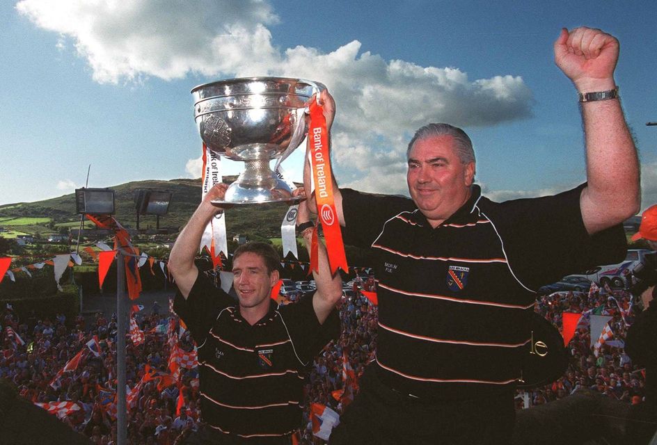 Joe Kernan and Armagh captain Kieran McGeeney with the trophy in 2002