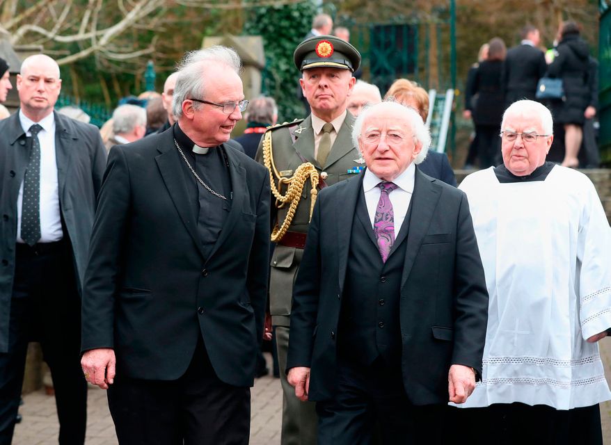 Irish President Michael D Higgins (second right) arriving for the funeral of Martin McGuinness. Photo: PA