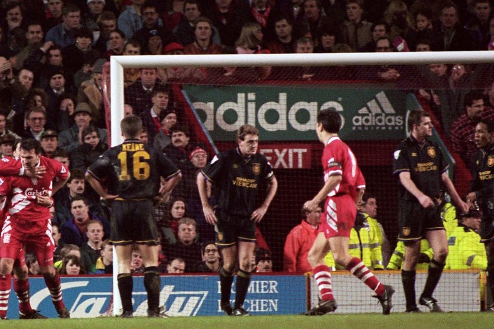 Neil Ruddock of Liverpool (left) celebrates scoring against Manchester United in January 1994
