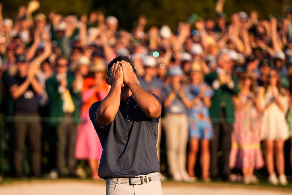 Rory McIlroy celebrates winning in a playoff against Justin Rose in the final round the Masters. (AP Photo/Julia Demaree Nikhinson)