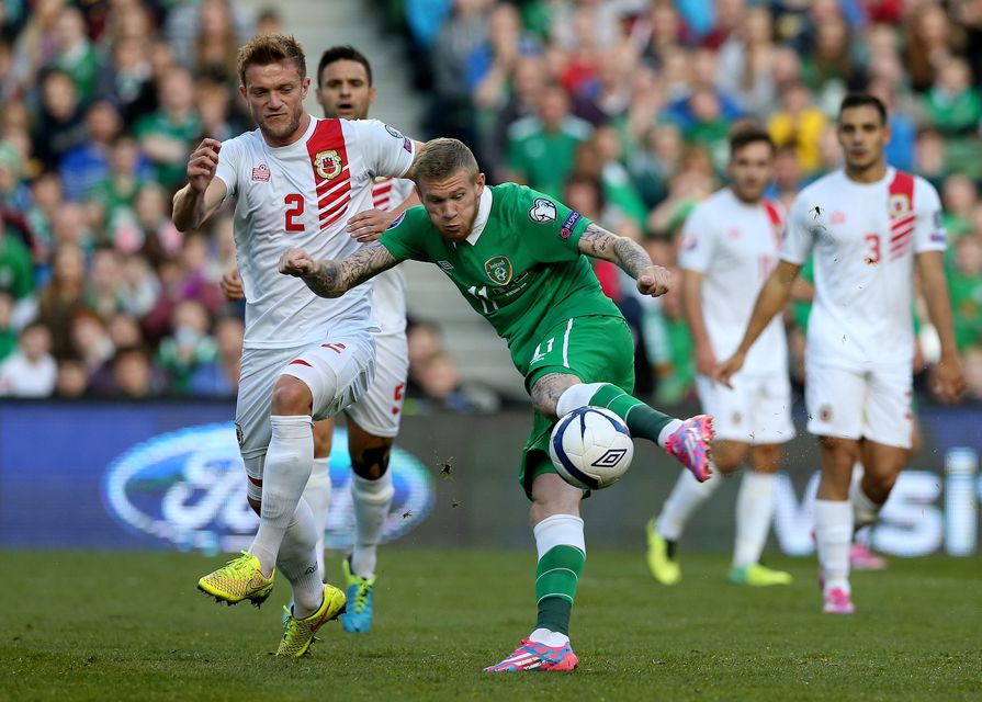 Republic of Ireland's James McClean (right) and Gibraltar's Scott Wiseman during the UEFA Euro 2016 qualifying match at Aviva Stadium, Dublin. PRESS ASSOCIATION Photo. Picture date: Saturday October 11, 2014. See PA story SOCCER Republic. Photo credit should read Brian Lawless/PA Wire.