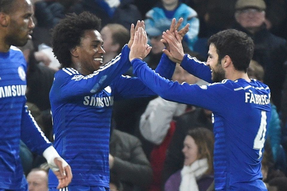 Willian (L) of Chelsea celebrates scoring against Everton with Cesc Fabregas