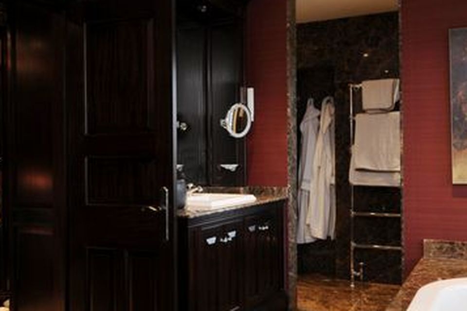 The dressing room boasts a full range of built-in wardrobes