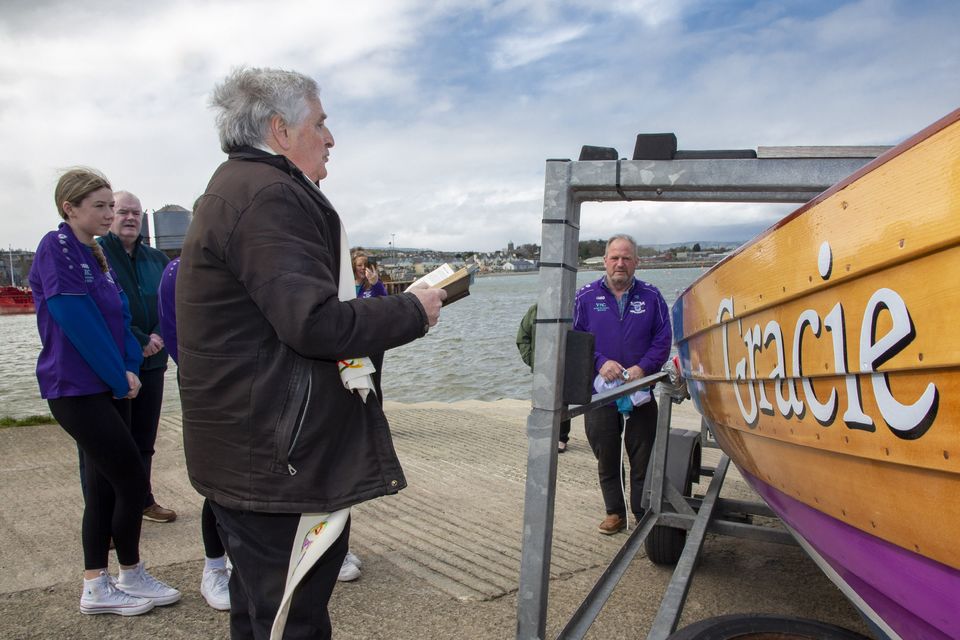 Fr. Gerard Deegan blessing the boats at the Vartry Rowing Club.