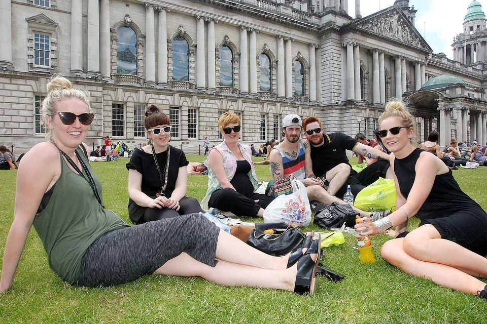 Sandra, Claire, Alison, Rich, Benjamin, Kelly take advantage from of their lunch hour from Urban outfitters to relax grounds of the City Hall in Belfast.