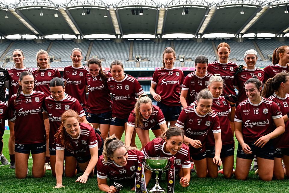 Galway players celebrate with the cup after their side's victory in the Lidl Ladies National Football League Division 2 final. Photo: Sam Barnes/Sportsfile