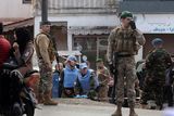 thumbnail: UN peacekeepers and Lebanese soldiers gather at the site where a UN peacekeeping force UNIFIL convoy came under small arms fire, in the village of Aqibya in south Lebanon, on December 15, 2022. - An Irish soldier of the UN peacekeeping force in south Lebanon near the Israeli border was killed and three wounded, Irish officials said. (Photo by Mahmoud ZAYYAT / AFP) (Photo by MAHMOUD ZAYYAT/AFP via Getty Images)