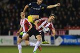 thumbnail: Southampton's Shane Long collides with Chris Basham of Sheffield United during their Capital One Cup quarter-final clash at Bramall Lane. Photo: Lynne Cameron/PA Wire