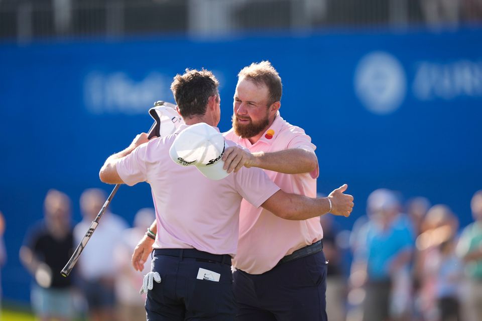 Shane Lowry celebrates with teammate Rory McIlroy