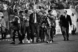 thumbnail: 16 October 1991; Republic of Ireland manager Jack Charlton leaves the pitch after the game surrounded by substitutes and backroom staff. UEFA Euro 1992 qualifying Group 7 match, Poland v Republic of Ireland, Stadion Miejski, Poznan, Poland (Ray McManus / SPORTSFILE)