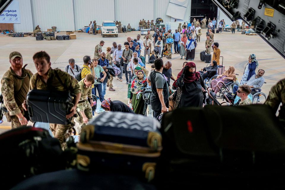 People board an RAF aircraft during the evacuation of British nationals, at Wadi Seidna Air Base in Sudan April 27, 2023. Phot Arron Hoare/UK MOD/Handout via REUTERS 