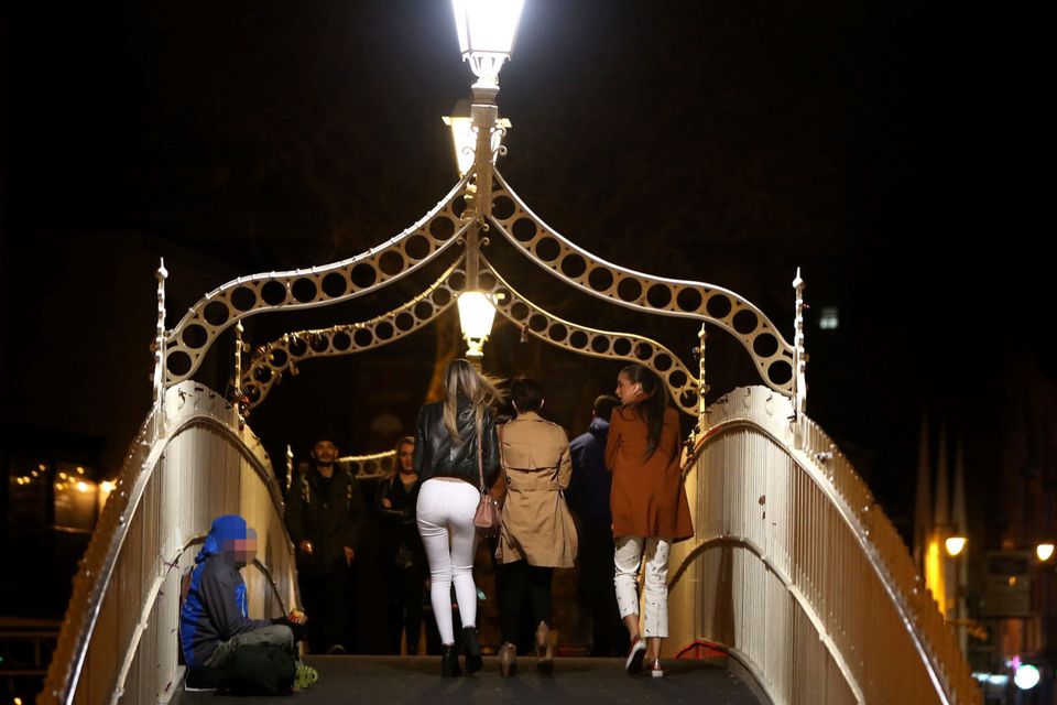 A homeless person braves the cold on Ha’penny Bridge (Stock picture)