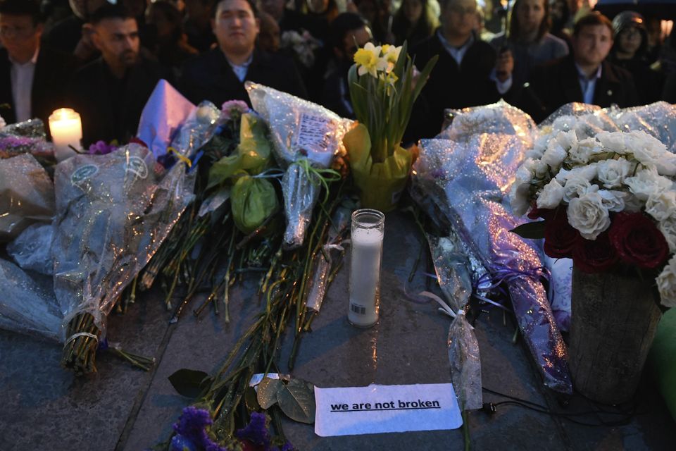 Messages of hope and grief are left at a vigil on Yonge Street in Toronto (Galit Rodan/AP)